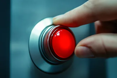 Finger Pressing A Large Red Emergency Button