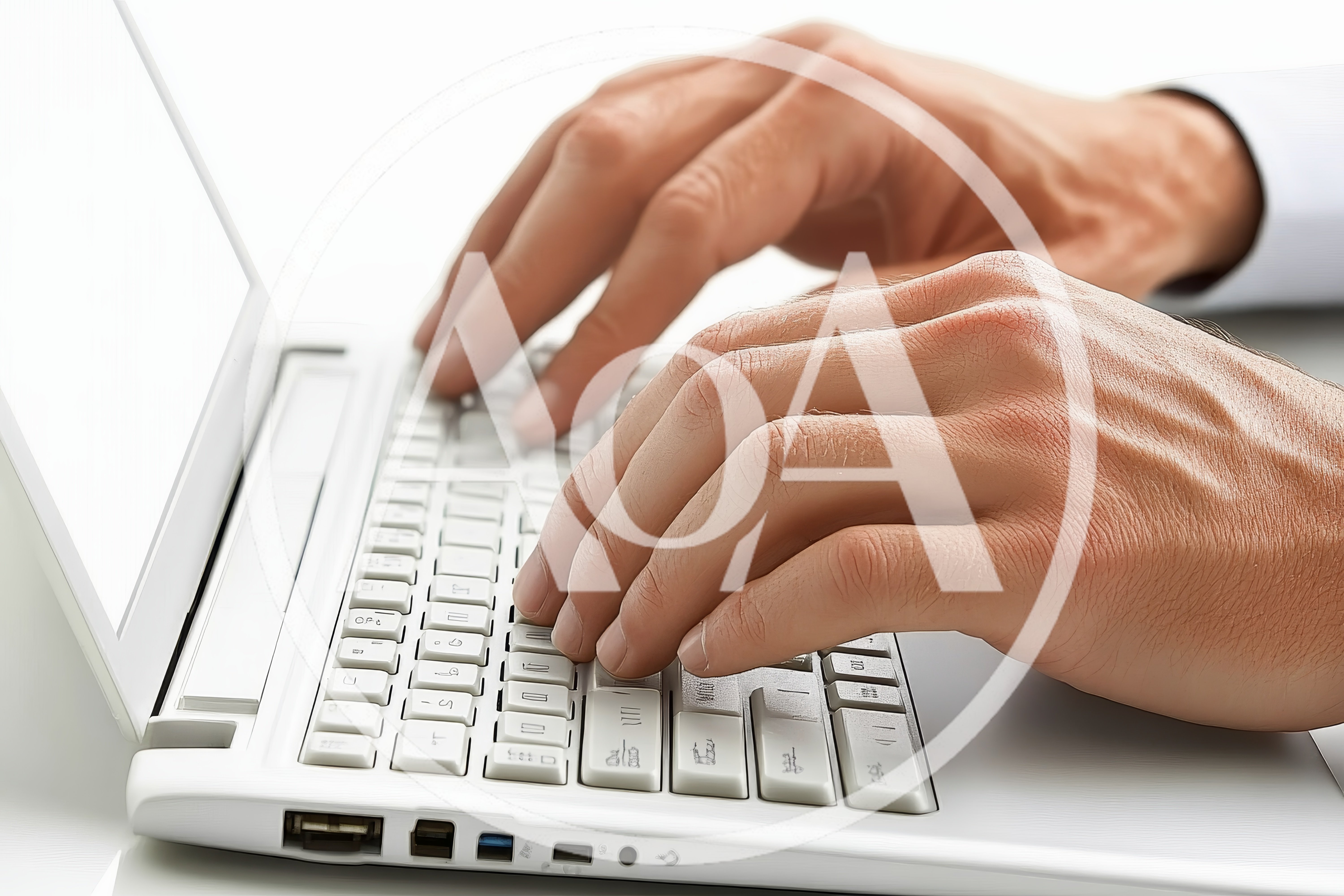 Close Up Of Hands Typing On White Laptop Keyboard