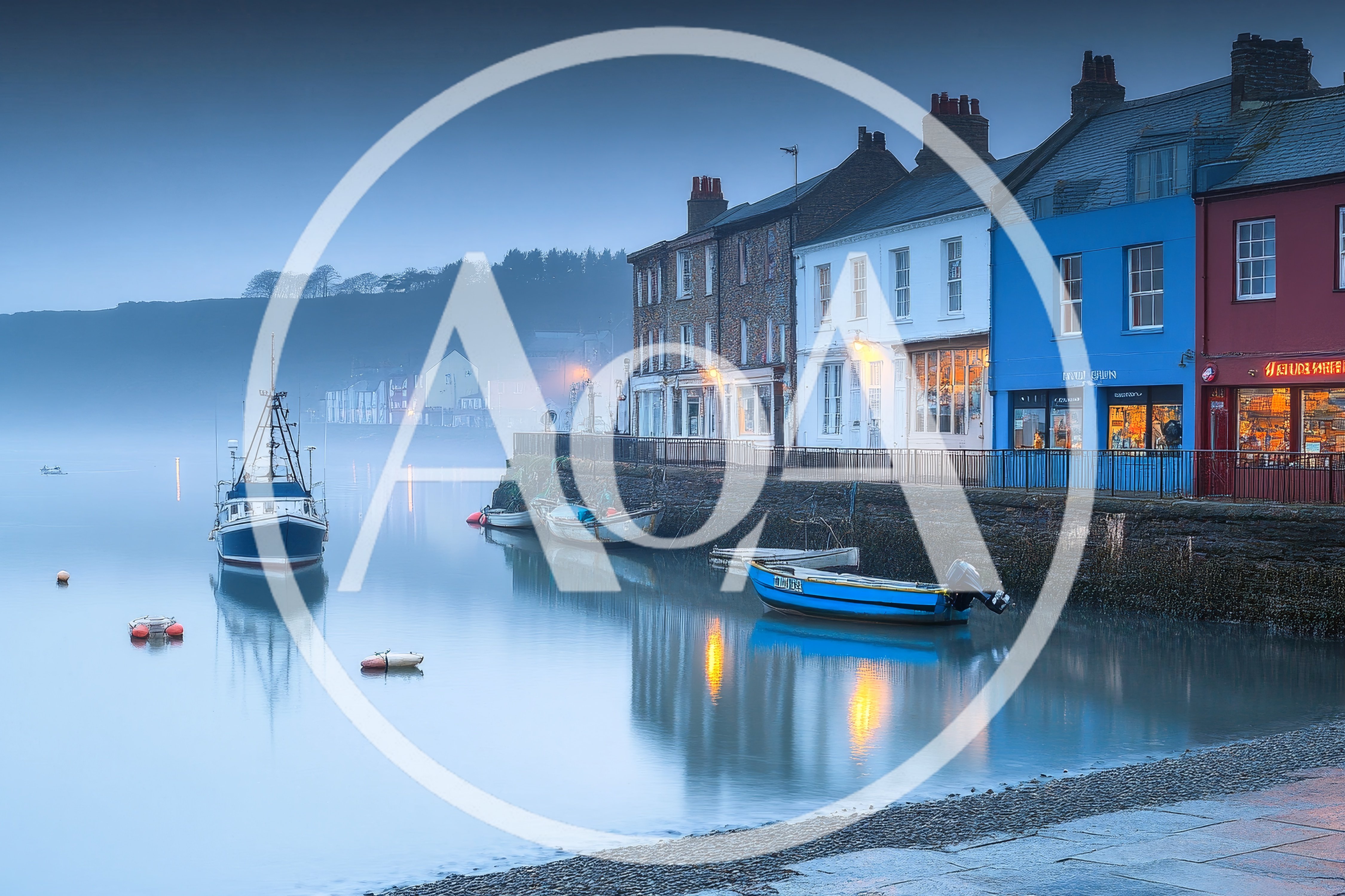 Fishing Boats Moored At A Misty Coastal Harbor