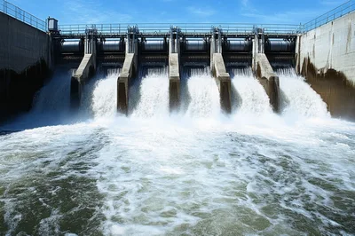 Water Rushing Through Open Dam Spillway Gates