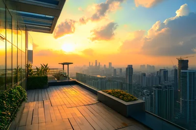Modern Rooftop Terrace Overlooking City Skyline At Sunset