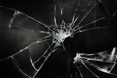 Shattered Glass Texture With Radial Cracks On Black Background