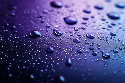Water Droplets On A Textured Purple Surface