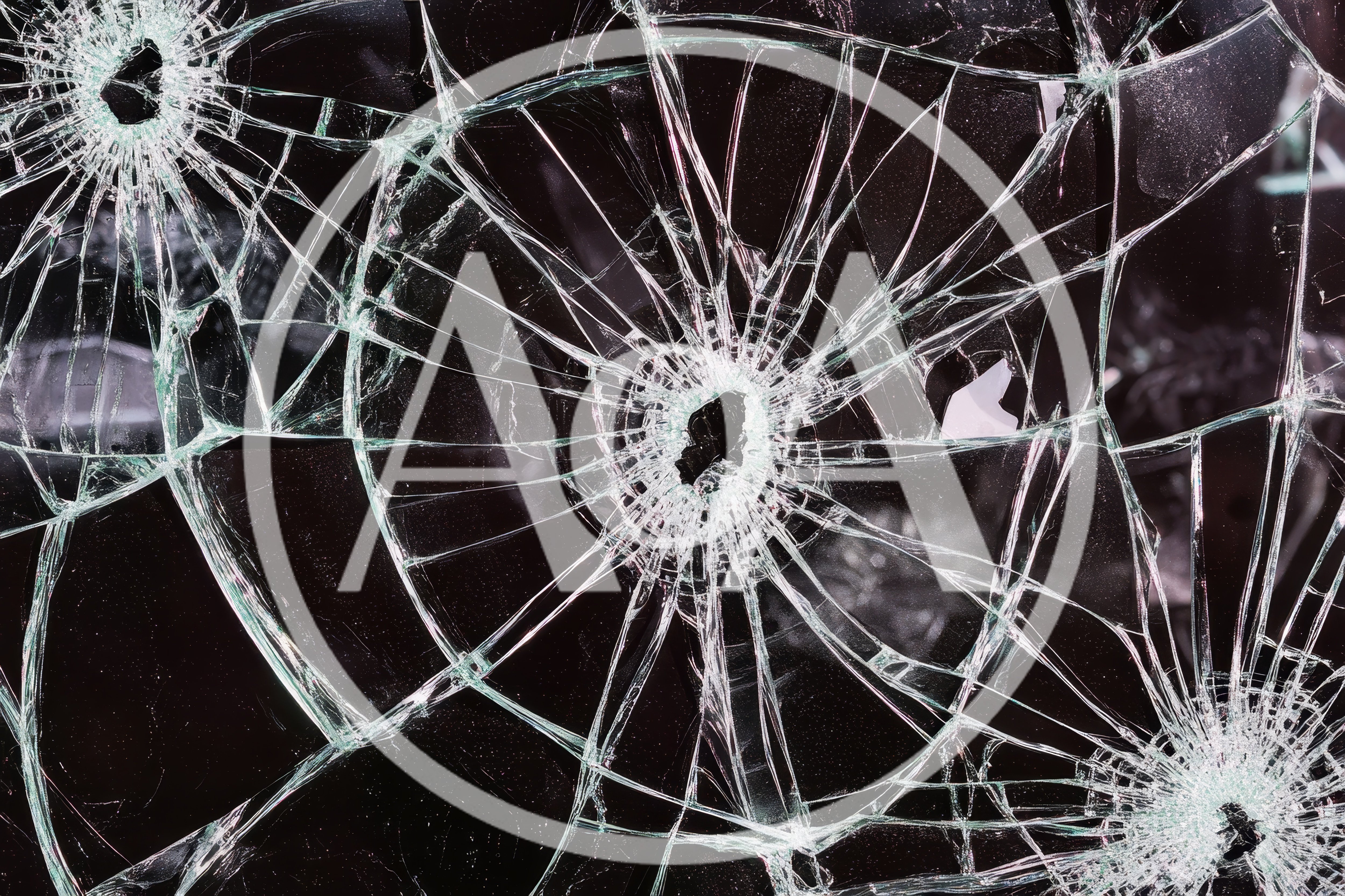Shattered Glass Surface With Multiple Bullet Hole Impacts