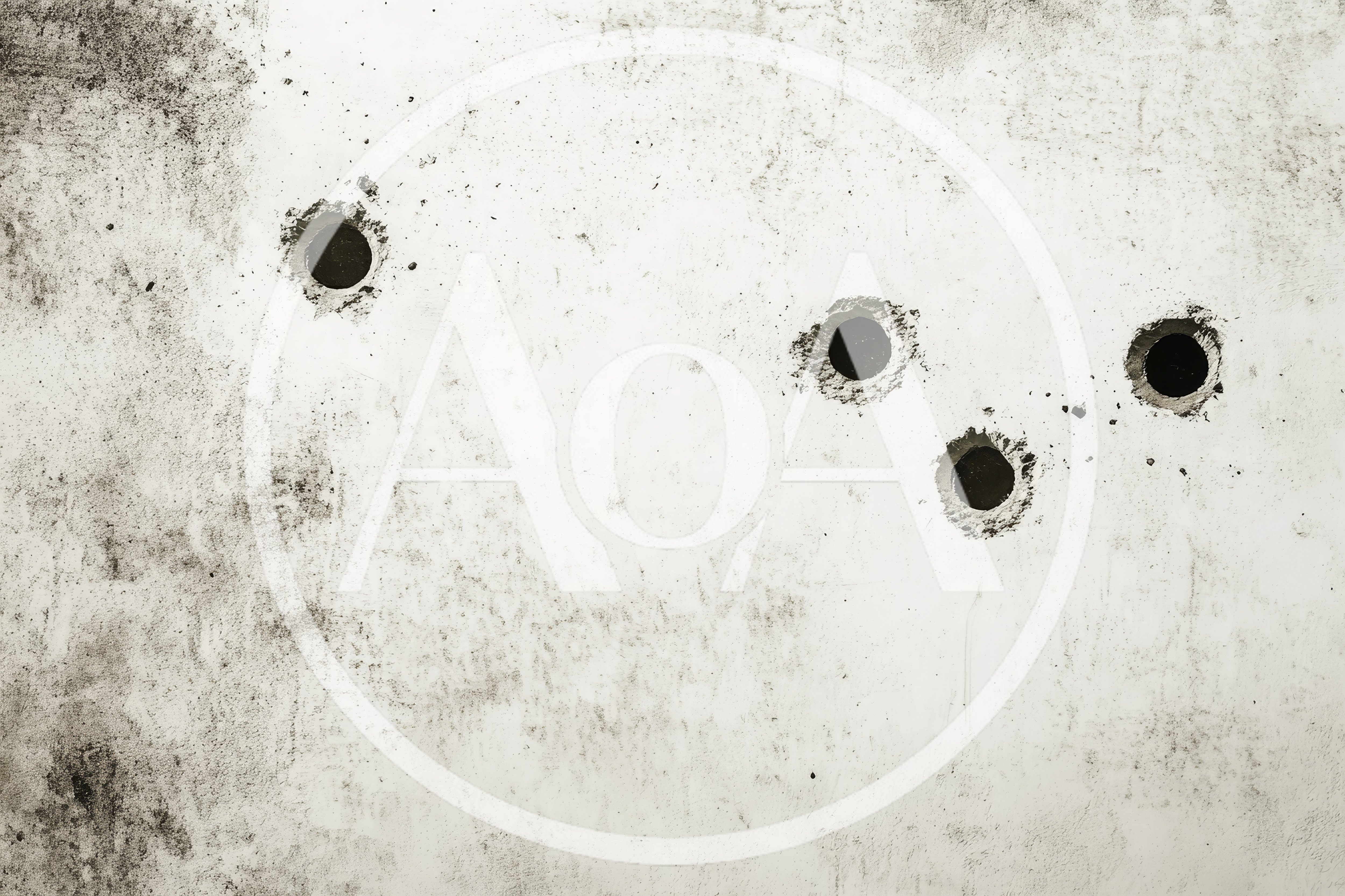 Four Circular Drill Holes In A Concrete Wall