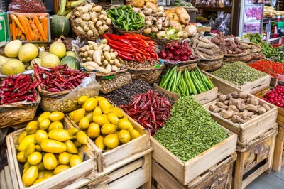 Assorted Spices and Vegetables at a Traditional Market