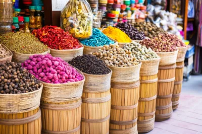Assorted Spices And Herbs In Woven Baskets