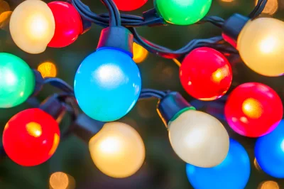 Colorful Christmas String Lights Glowing In The Dark