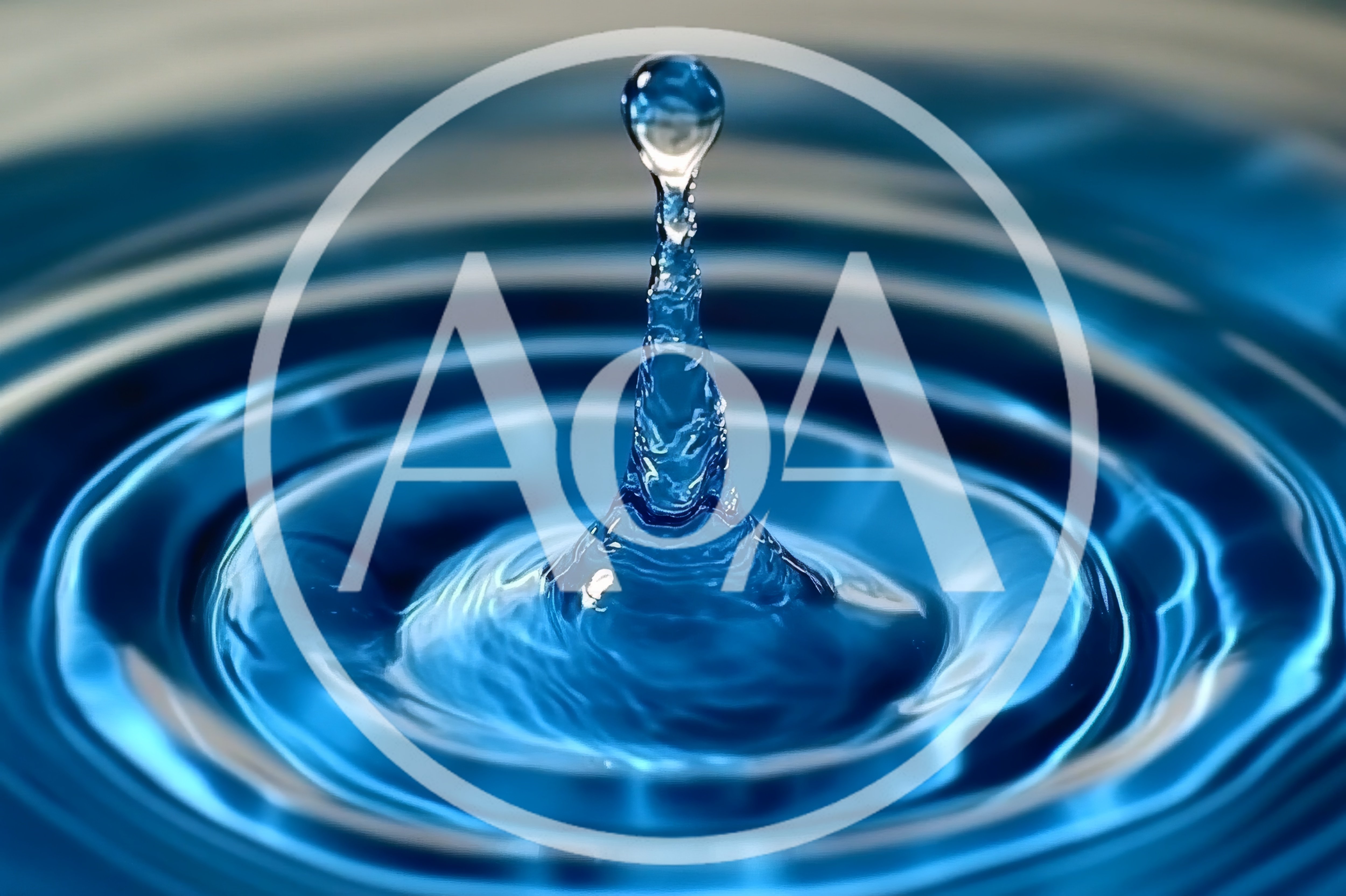 Blue Water Drop Impact Creating Concentric Ripples