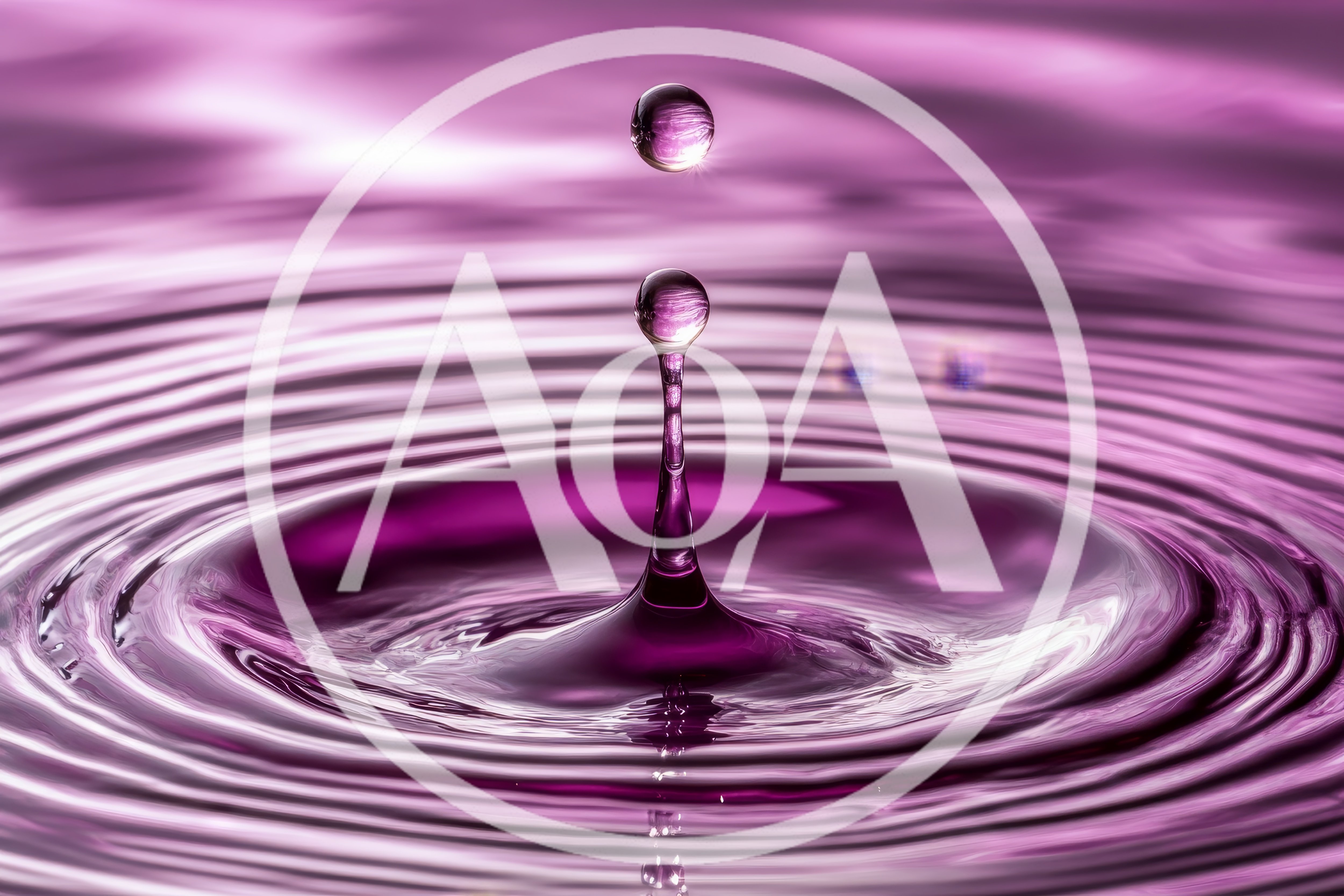 Purple Water Drop Impact Creating Concentric Ripples