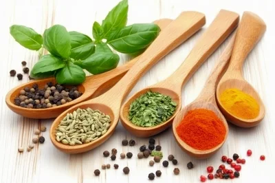 Wooden Spoons Filled With Various Spices And Herbs