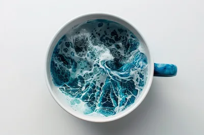 Ocean Waves Swirling Inside A White Coffee Mug