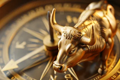 Golden Bull Statue Standing On A Vintage Compass