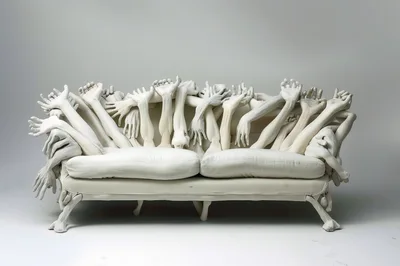 Surreal White Sofa Decorated With Human Arms