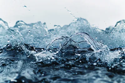 Dynamic Water Splash With Droplets And Ripples