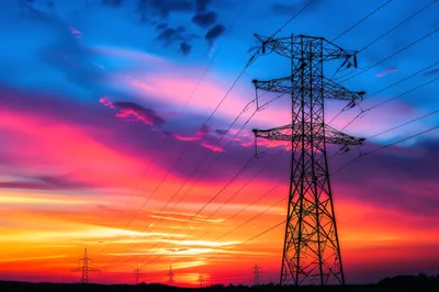 High Voltage Electricity Transmission Tower at Sunset