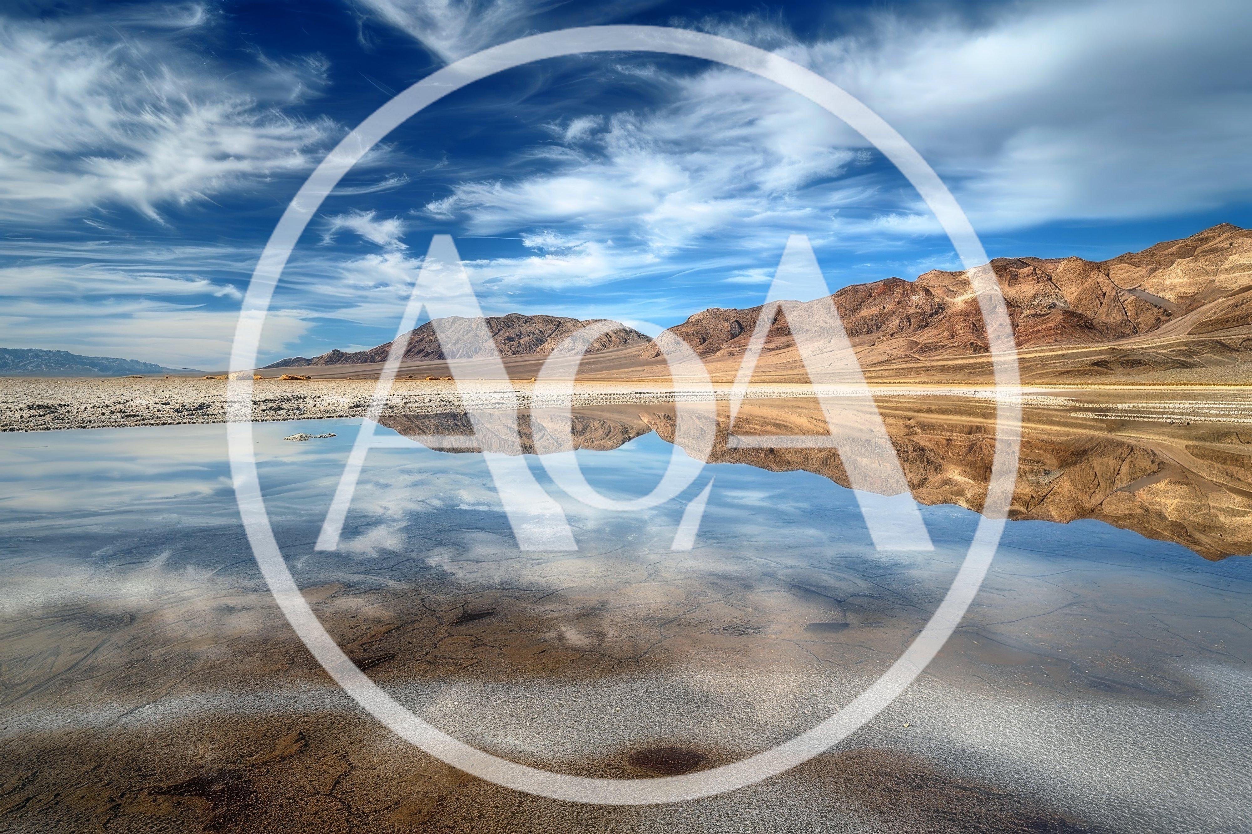 Reflective Salt Flats and Mountains in Death Valley