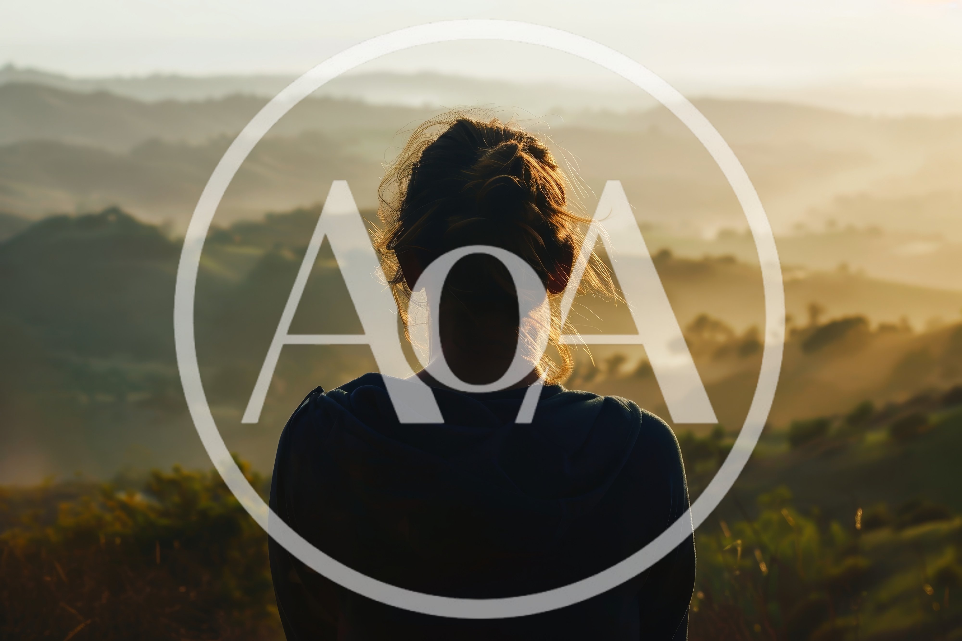 Woman Looking Over Misty Rolling Hills At Sunrise