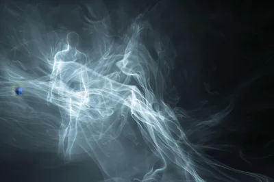 Ethereal Human Silhouette Formed From Swirling Smoke
