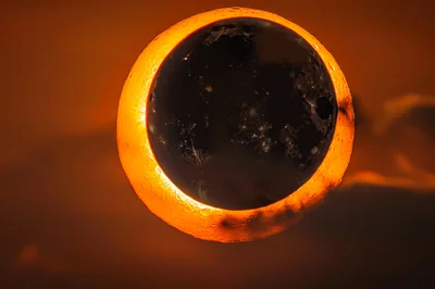 Surreal Solar Eclipse With Glowing Orange Ring