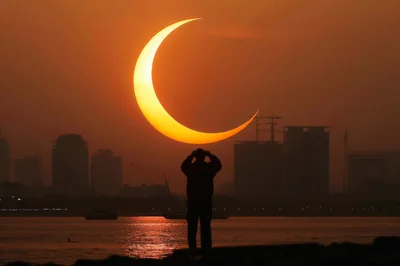Silhouette Of A Person Watching A Solar Eclipse