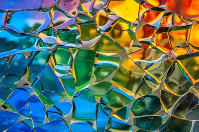 Abstract Background Of Colorful Shattered Glass Fragments