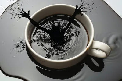 Surreal Human Figure Emerging From A Coffee Cup