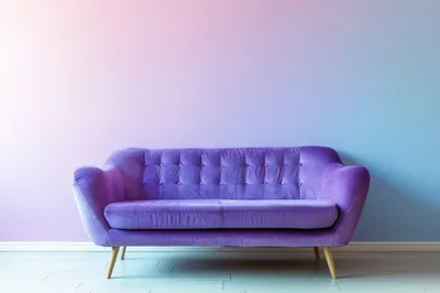 Purple Velvet Sofa Against A Gradient Wall