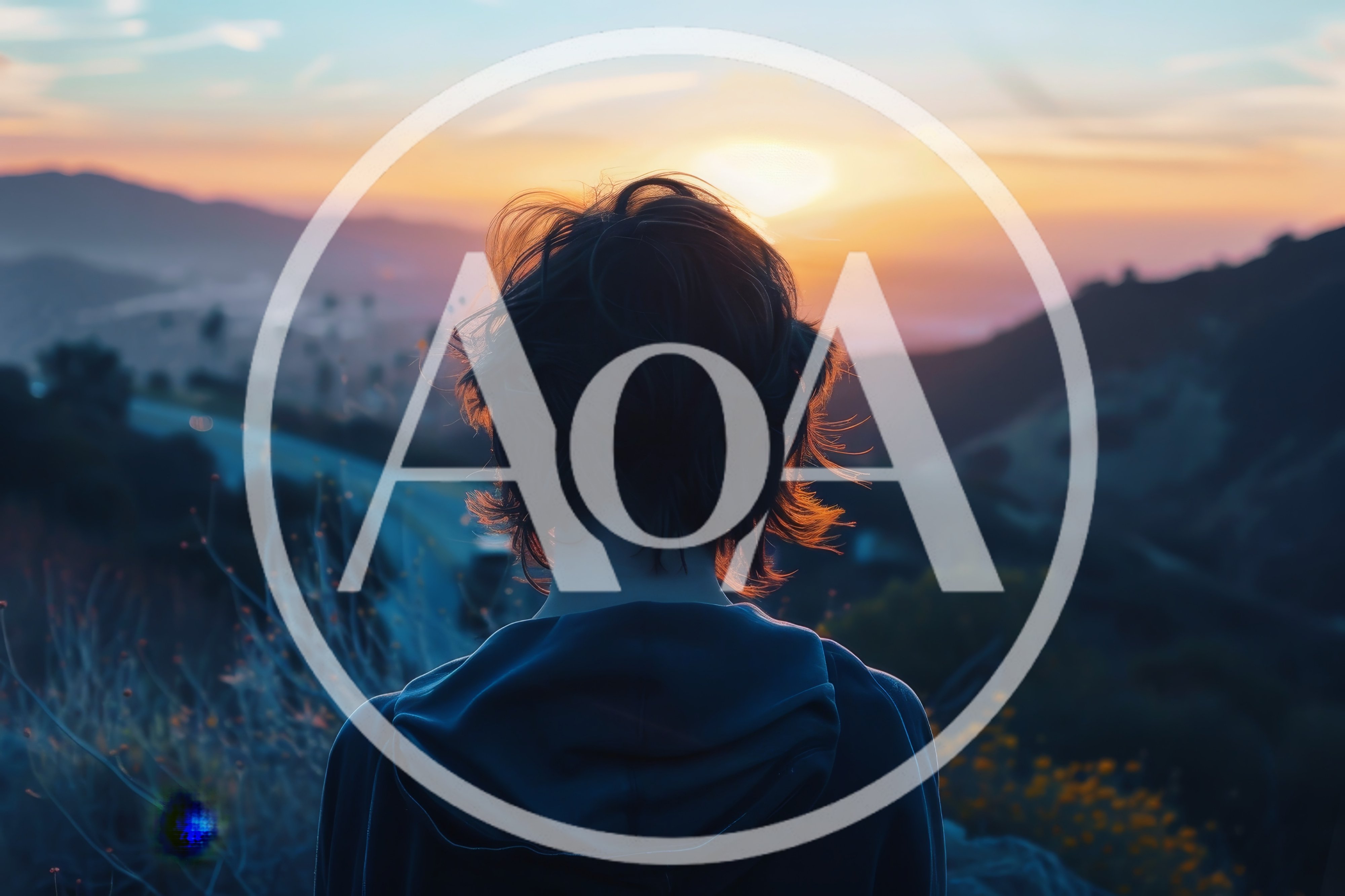 Person Standing Alone Looking At Sunset Over Mountains