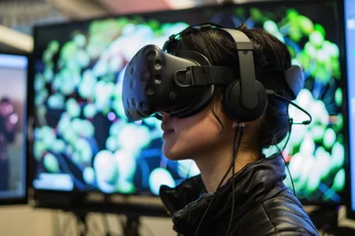 Young Woman Wearing Virtual Reality Headset In Laboratory