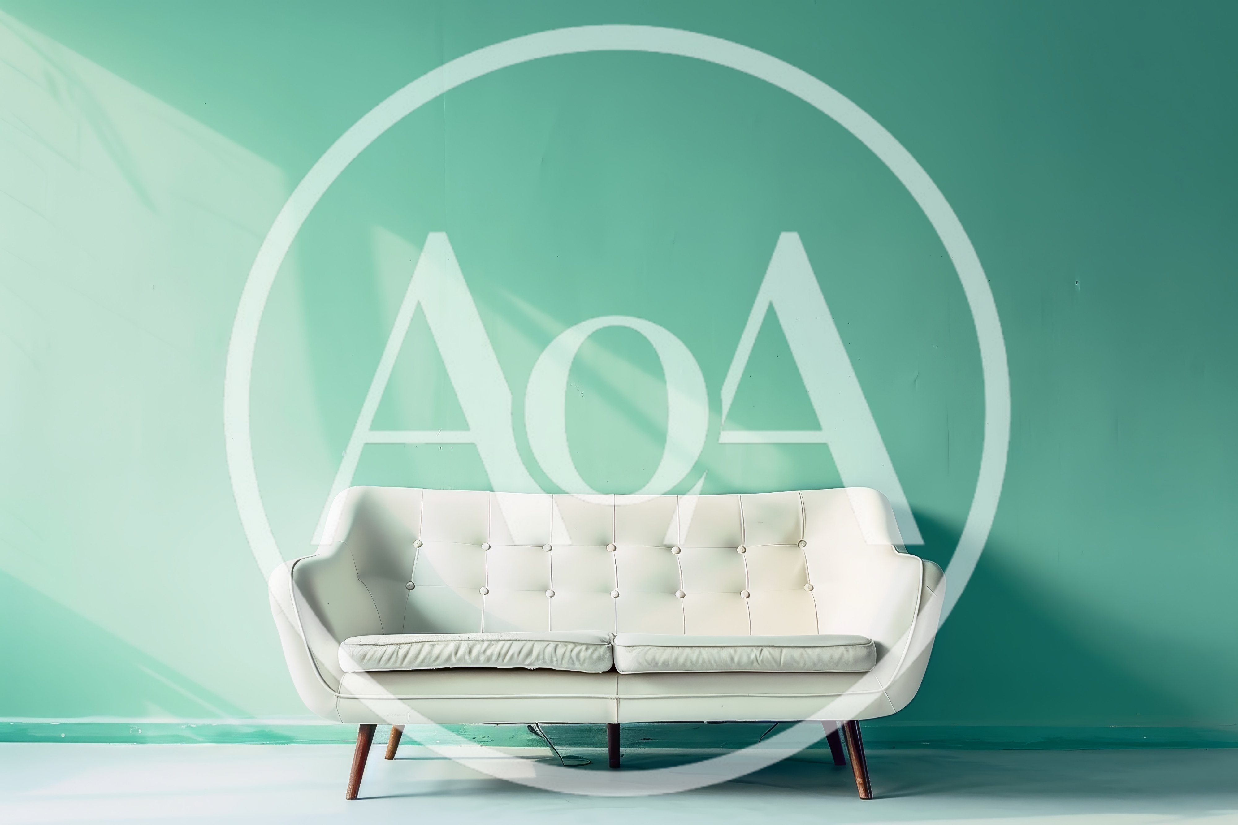 White Mid-Century Modern Sofa Against Mint Green Wall