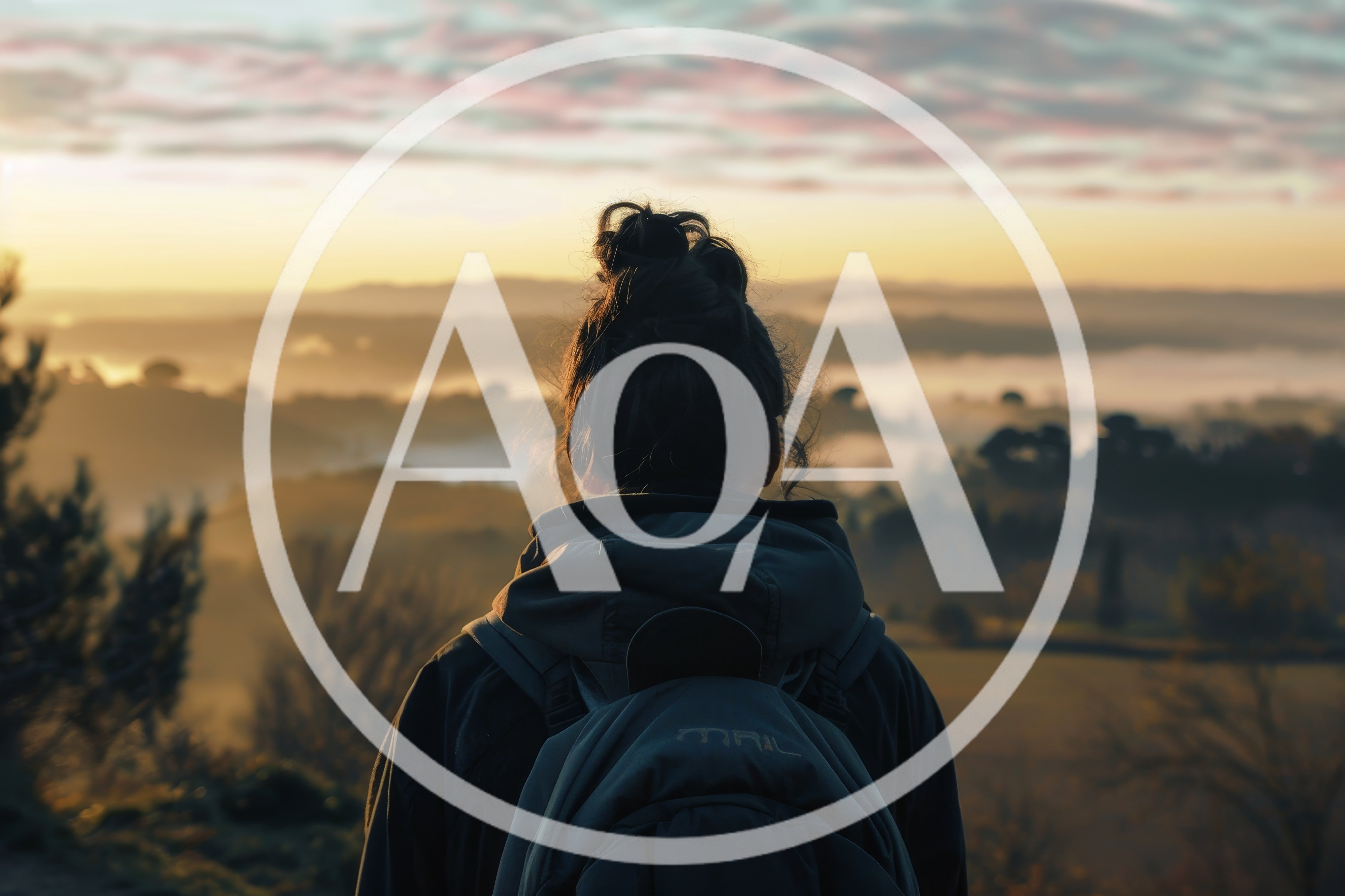Woman With Backpack Looking At Misty Sunrise