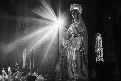 Statue Of The Virgin Mary In A Dimly Lit Church