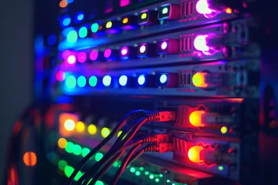 Server Rack With Glowing Network Cables And Status Lights