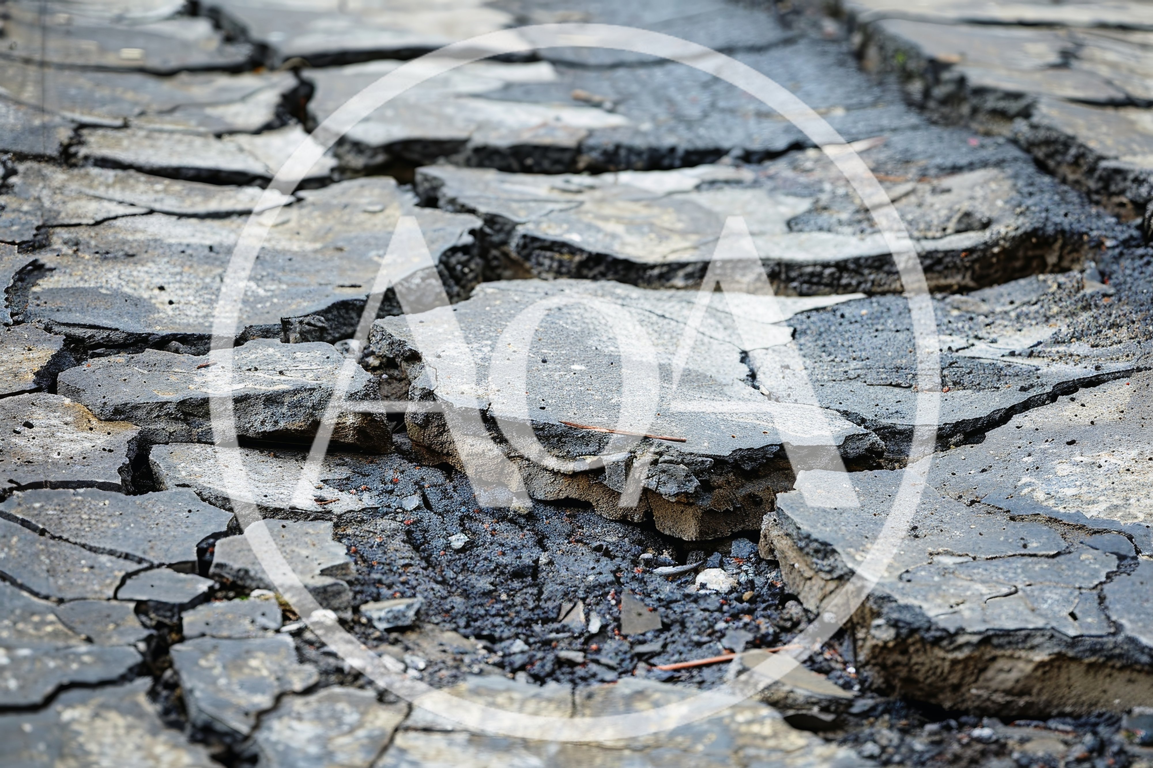 Cracked Asphalt Surface With Deep Fissures