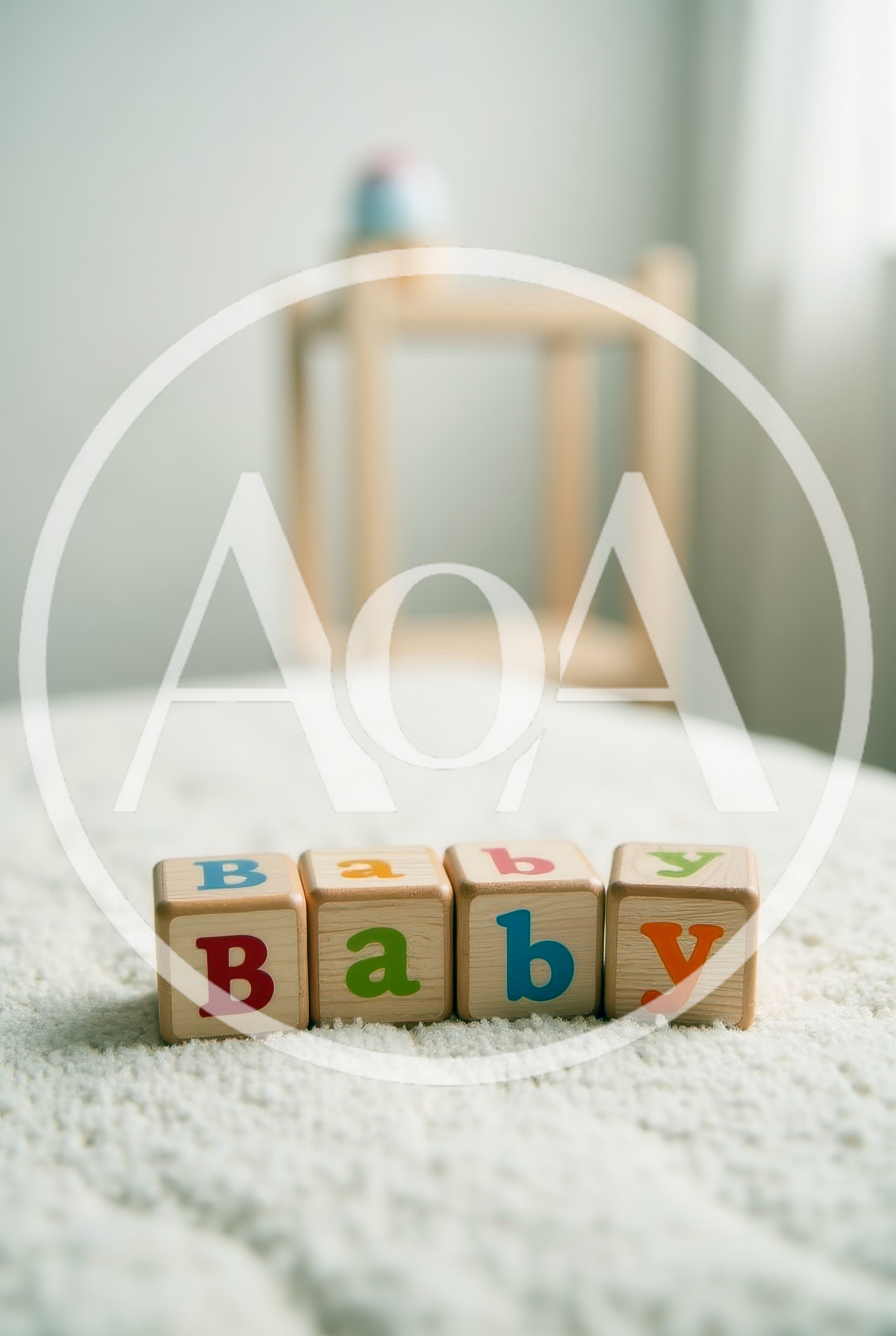 Wooden Baby Blocks Spelling Baby on Soft Blanket