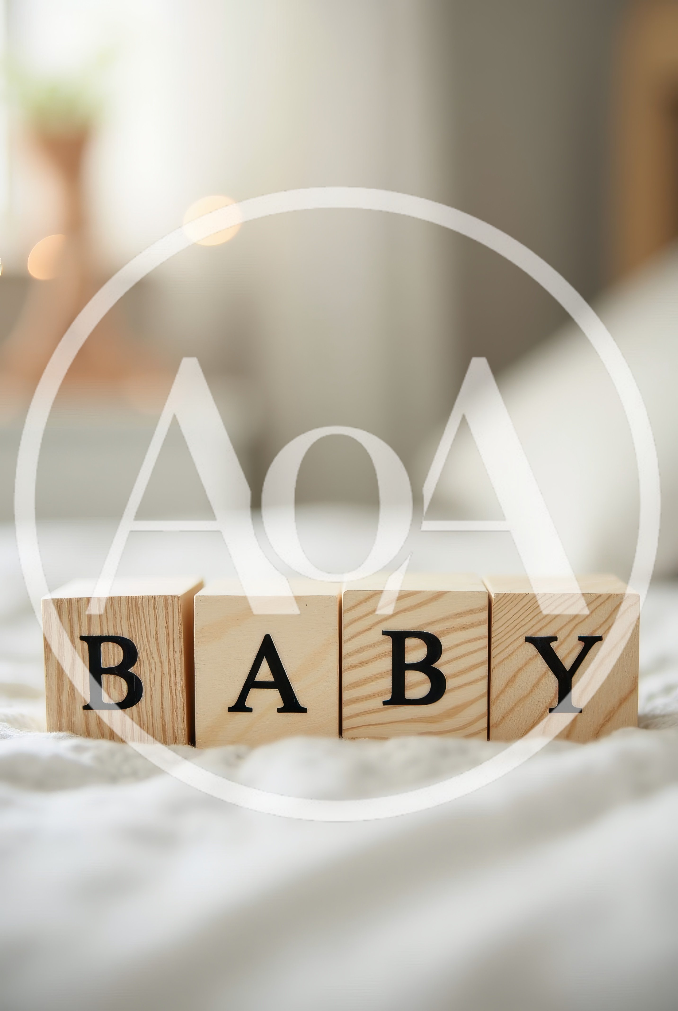 Wooden Baby Blocks Spelling Baby on Bed