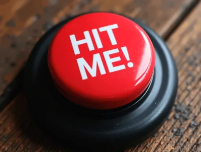 Red Hit Me Button On Wooden Surface