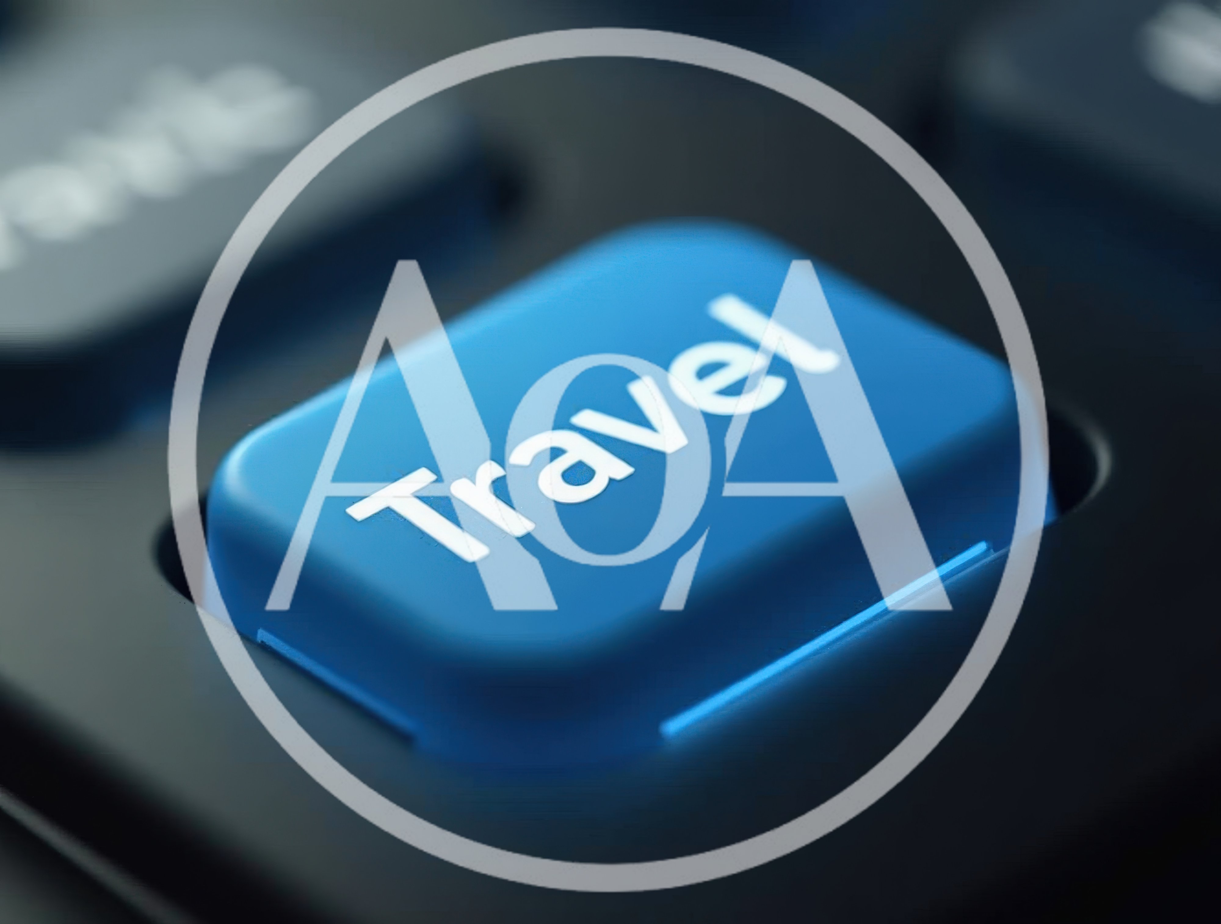 Blue Travel Button On A Dark Computer Keyboard