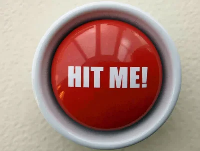 Red Hit Me Button Mounted On A Wall