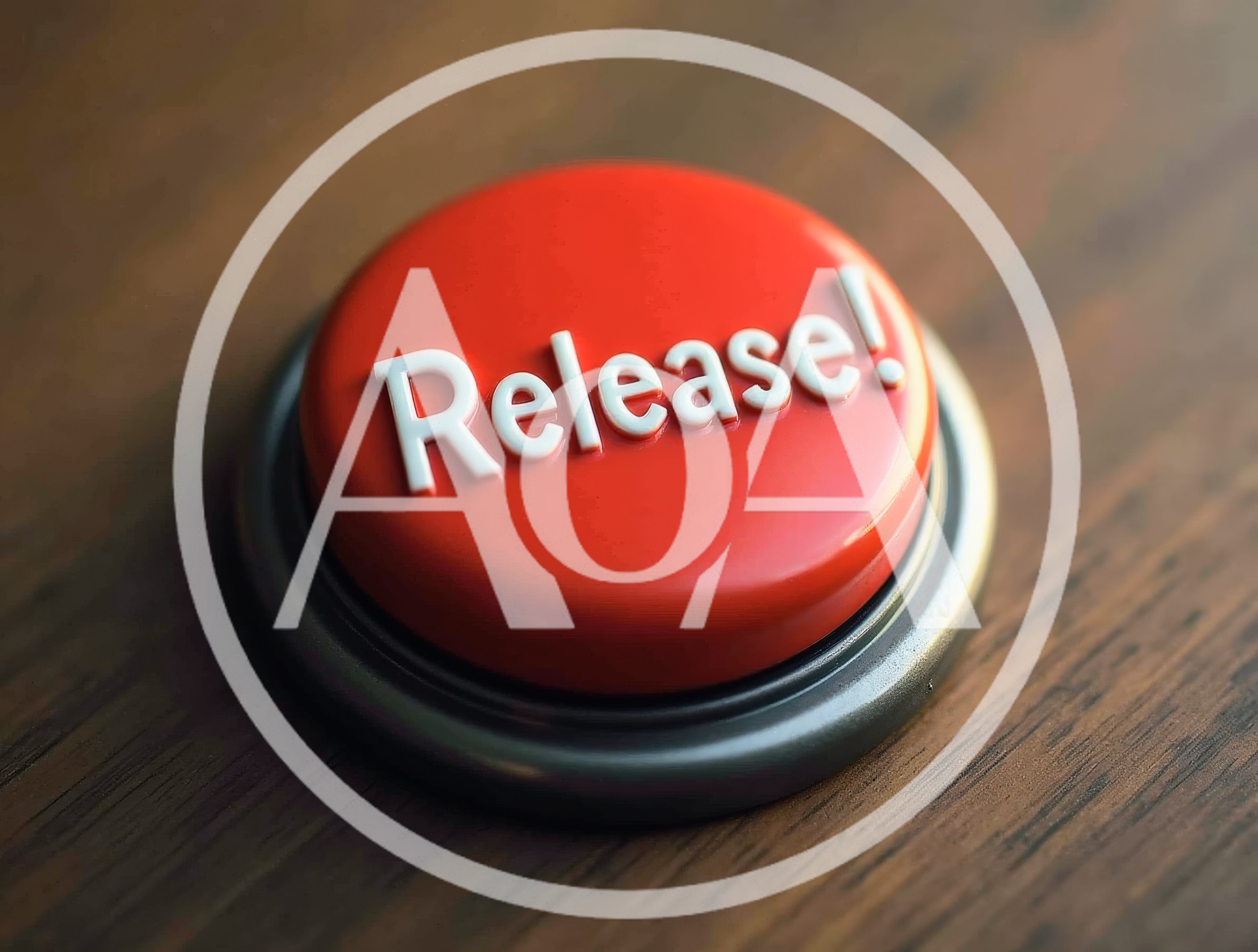 Red Release Button On A Wooden Desk