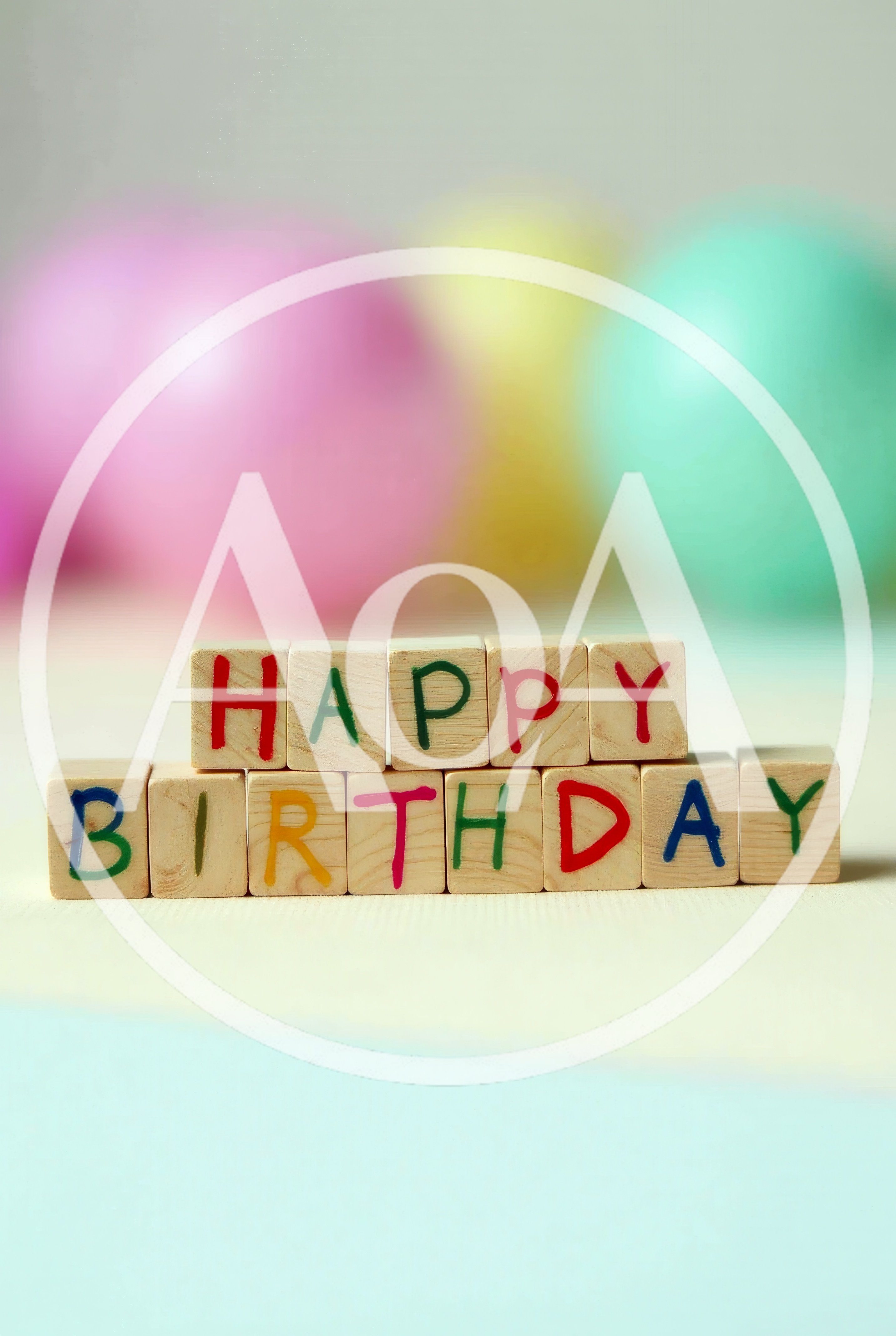 Wooden Blocks Spelling Happy Birthday With Blurred Balloons