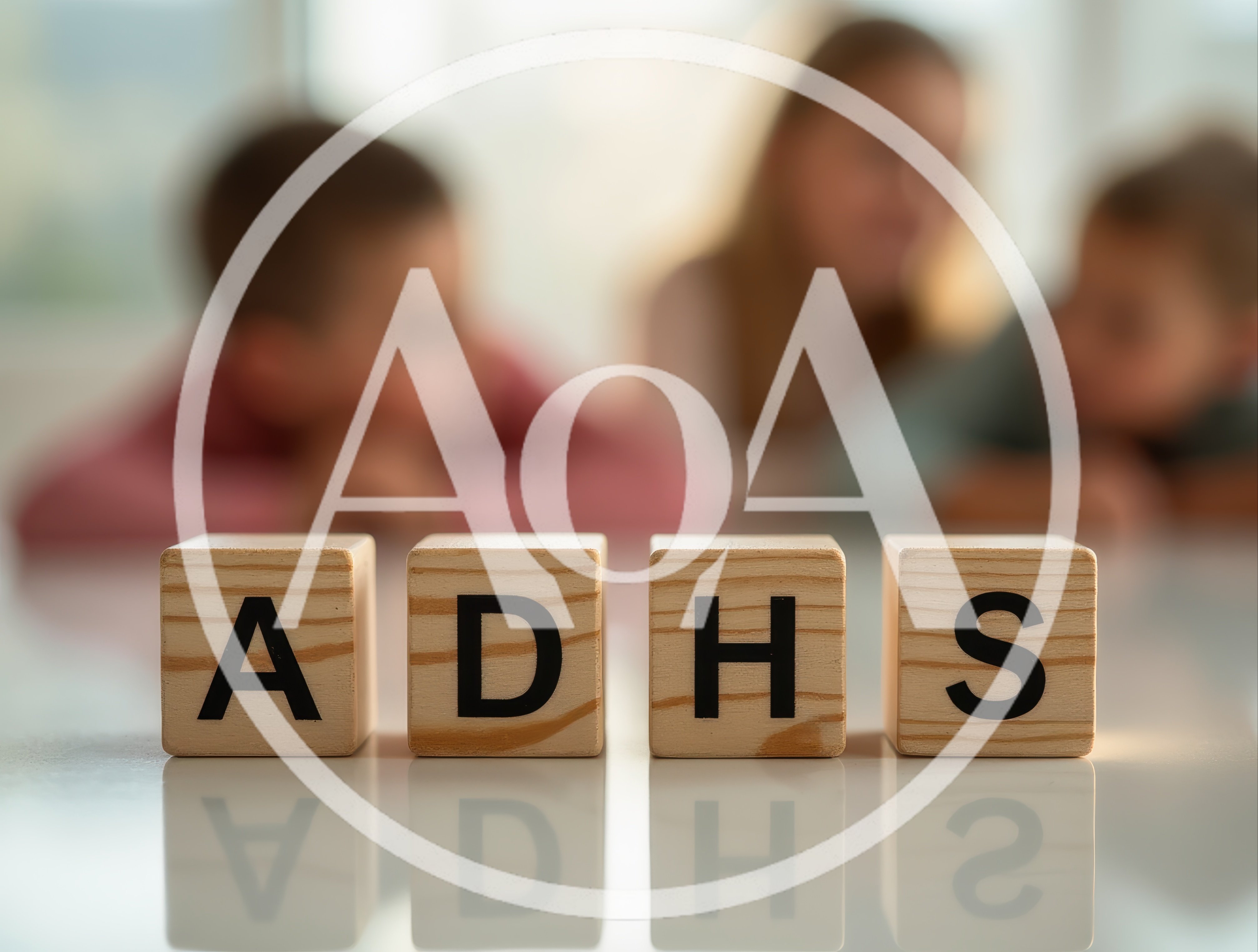 Wooden Blocks Spelling ADHS With Blurred Children In Background