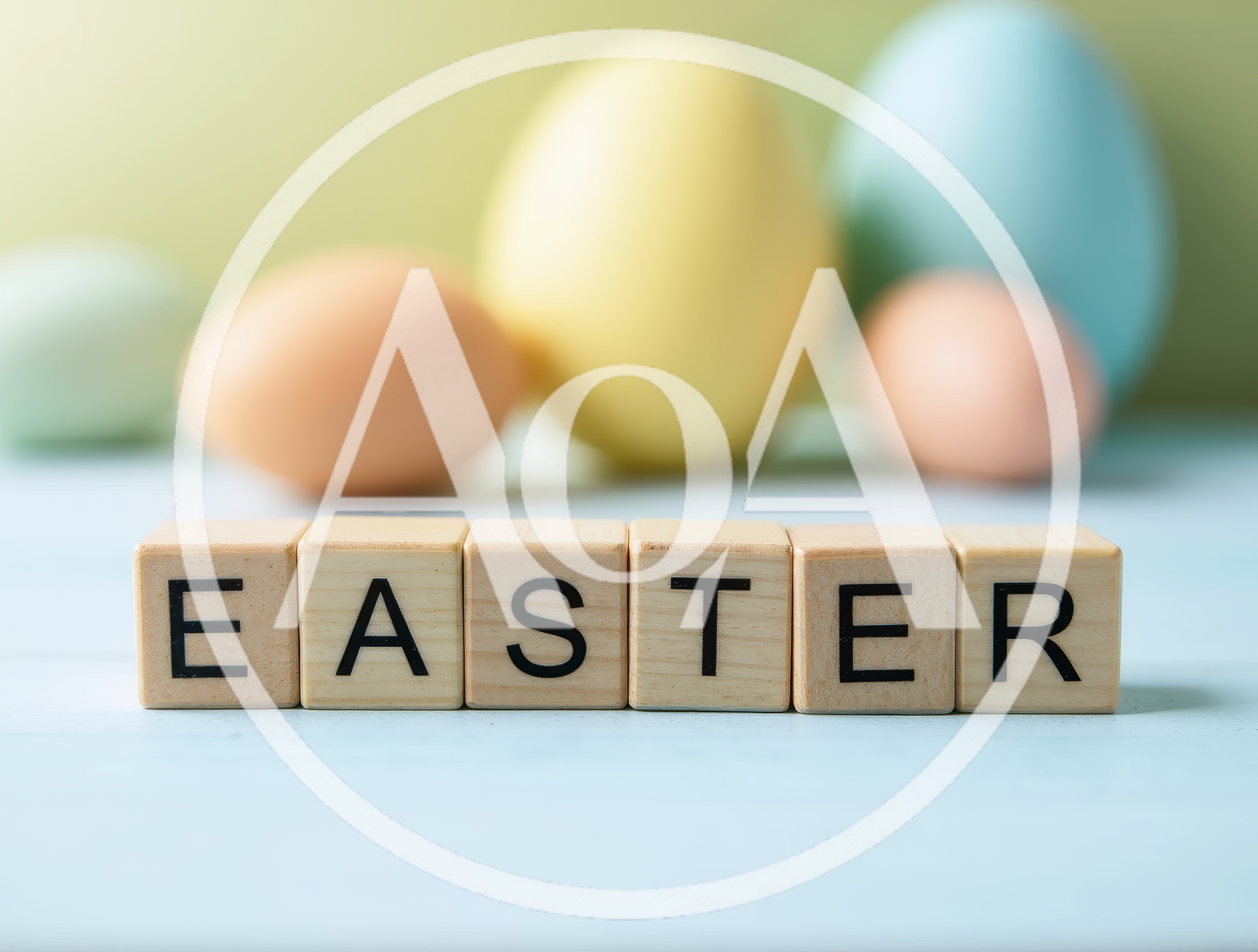 Wooden Blocks Spelling Easter With Pastel Colored Eggs