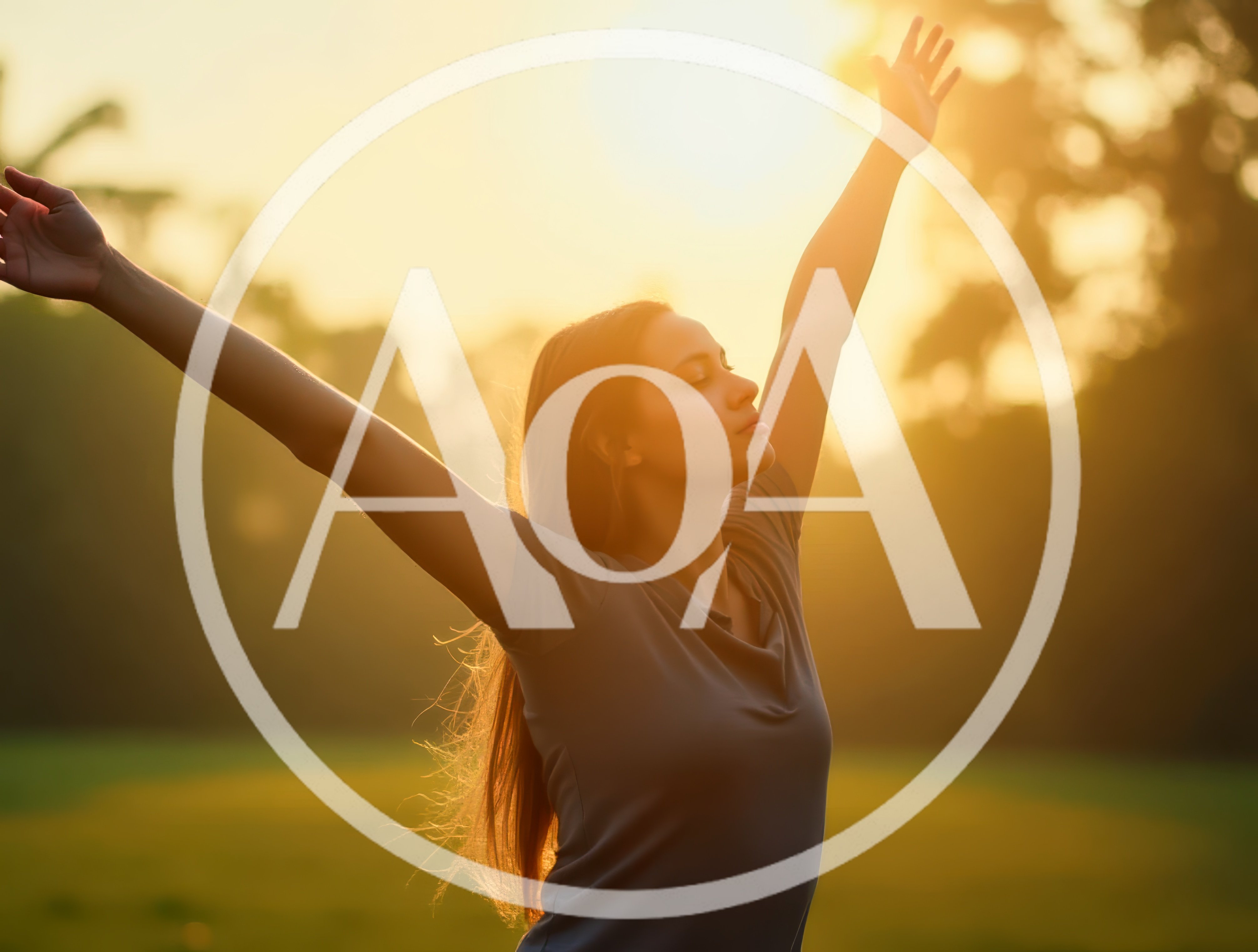 Young Woman Enjoying Sunset With Arms Raised
