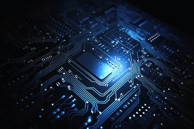 Close Up Of Glowing Blue Computer Circuit Board