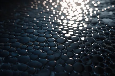 Abstract Background Of Glossy Dark Spheres With Bokeh