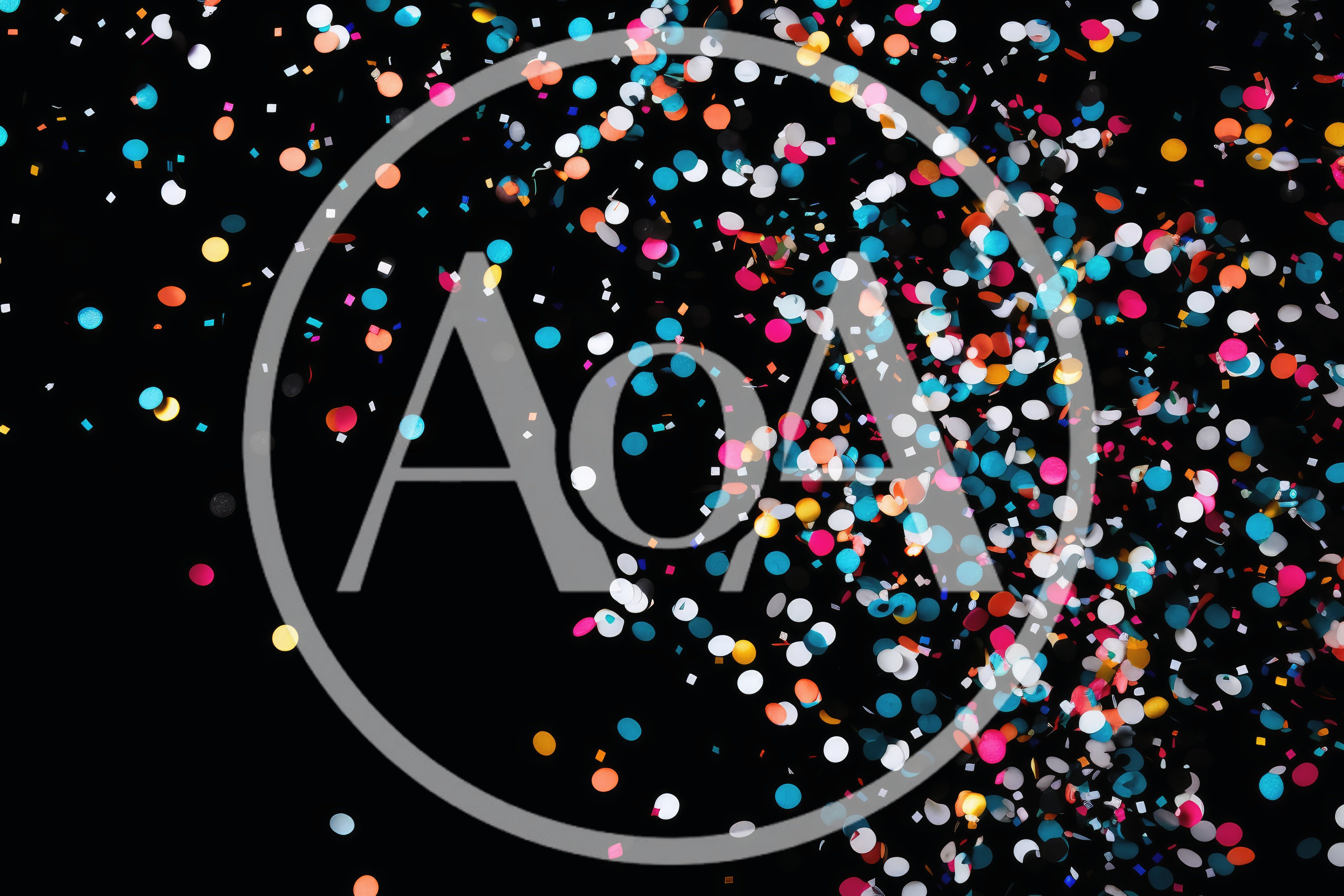 Colorful Confetti Falling Against A Black Background