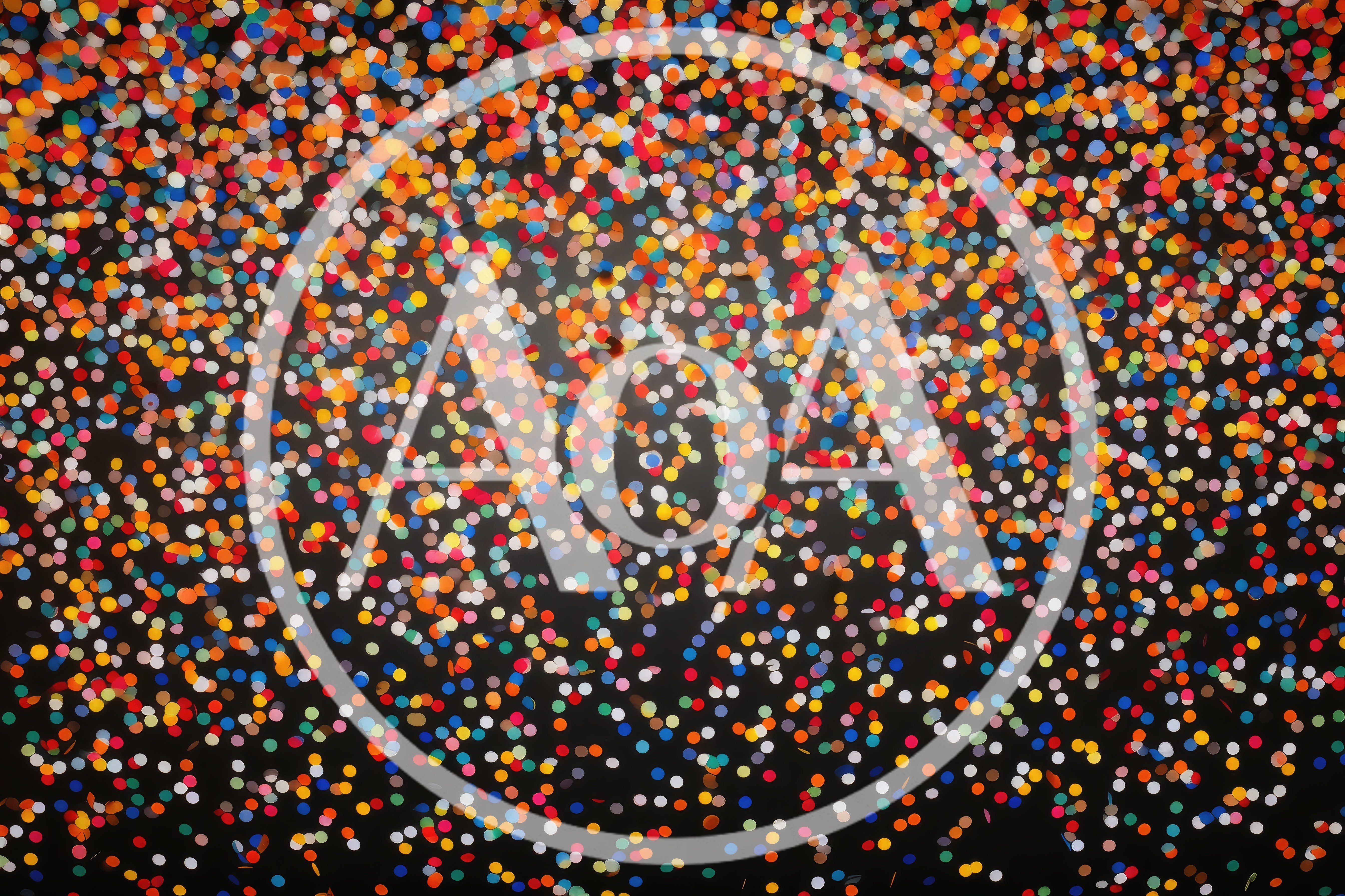 Colorful Confetti Falling Against A Dark Background