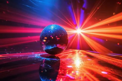 Disco Ball Reflecting Vibrant Red and Blue Laser Lights